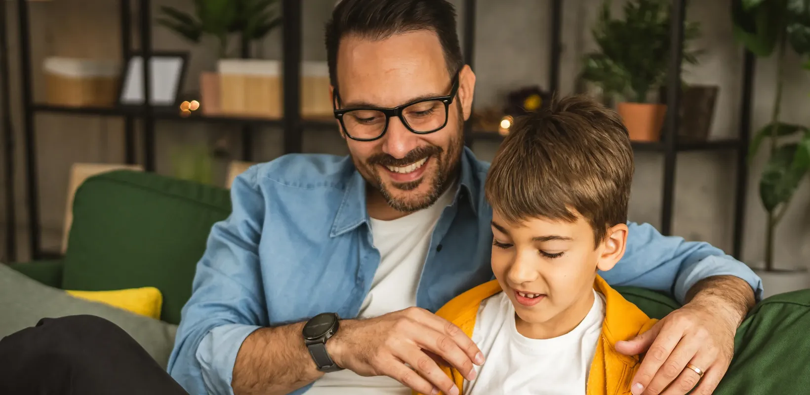 Father and child smiling together